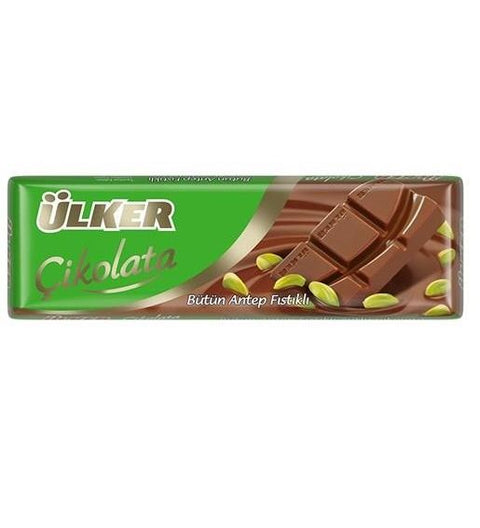 Ülker Chocolate bar with pistachios packaging featuring a green background and gold accents. The text indicates that it contains whole Antep pistachios.