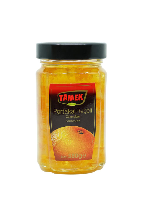 Jar of Tamek Orange Jam featuring a bright orange label with the product name in both Turkish and English, showcasing the jam's natural texture and vibrant color.