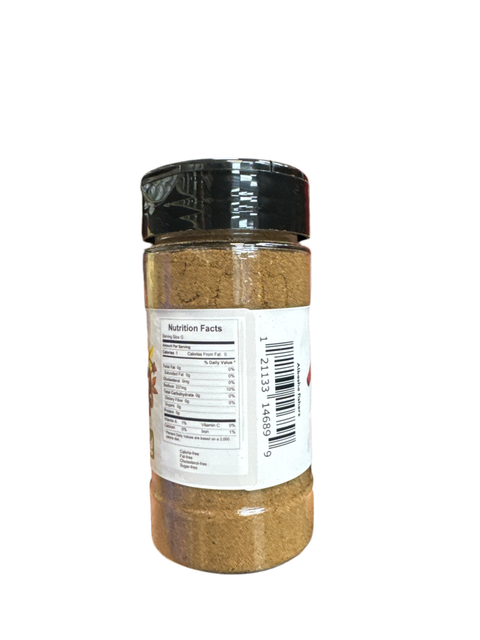 a jar of ground spices on a white background