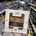 An individual holding a beautifully packaged box of butter cookies from Albasha while shopping. This assortment of crafted cookies serves as an ideal gift for Valentine's Day, offering fresh baked delight. Butter cookies, Cookies.