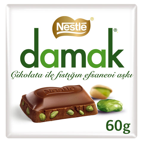 Nestle Damak pistachio milk chocolate packaging featuring a piece of chocolate with pistachios. The image showcases the iconic white wrapper with green branding and the Nestle logo, highlighting the product's unique blend of rich chocolate and crunchy pistachios, suitable for chocolate lovers.