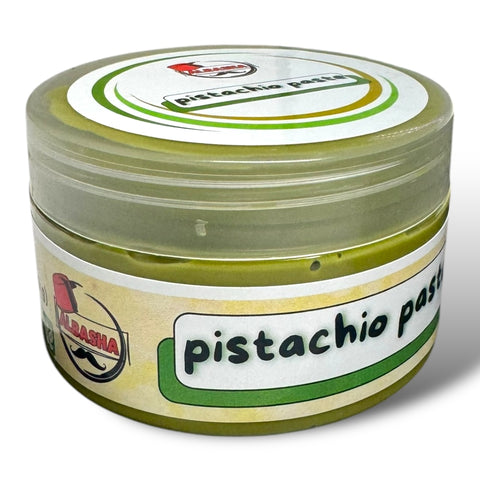 a jar of pistachio paste on a white background