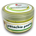 a jar of pistachio paste on a white background