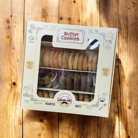 A top view of a packaged box of assorted butter cookies from Albasha, highlighting different flavors and textures. These delicious crafted cookies are perfect for gifting on Valentine's Day, promising a fresh baked experience. Butter cookies, Cookies.