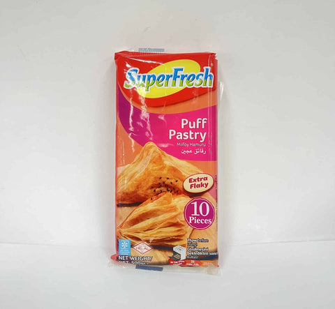 Package of Superfresh Puff Pastry weighing 500g, featuring ten flaky pastry pieces. The packaging is colorful, highlighting the product's extra flakiness and the text 'Puff Pastry' in both English and Turkish.