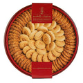 A beautifully arranged round tin of Zalatimo Sweets featuring an assortment of sesame cookies and butter cookies, showcasing a traditional Middle Eastern design. The tin is red with a gold logo and is filled with cookies with a crispy texture and visible nuts. Ideal for gifting or sharing during special occasions.